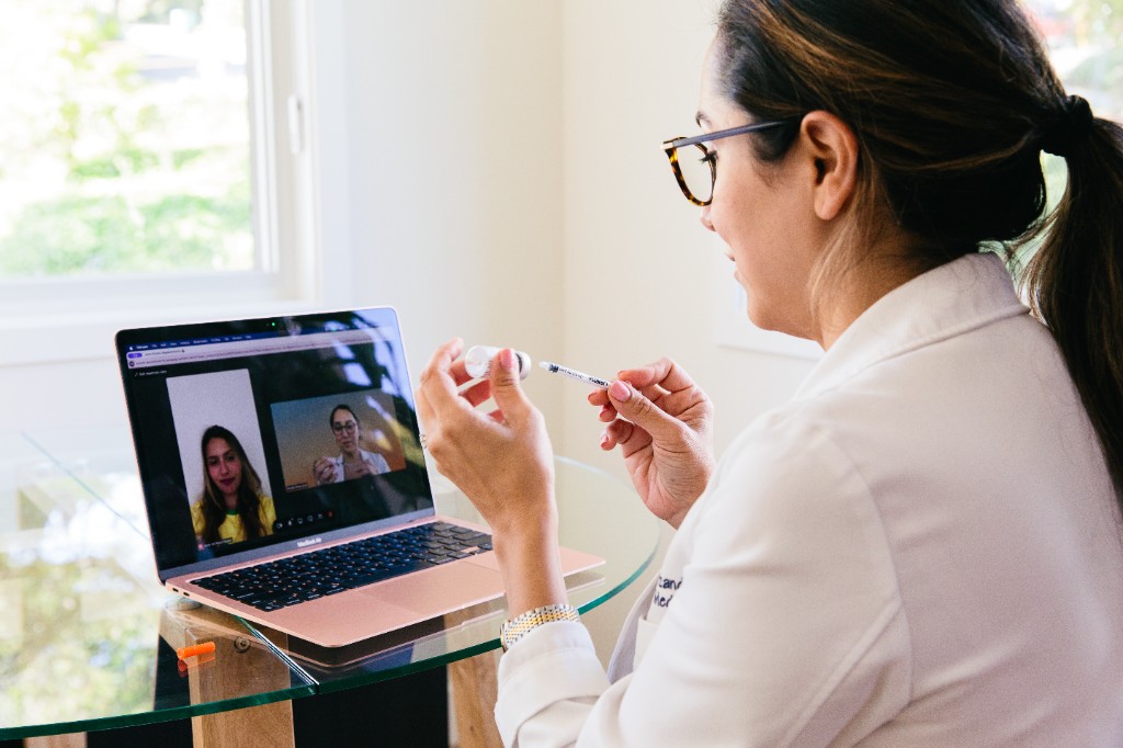 Patient connecting with a physician through a virtual telehealth visit